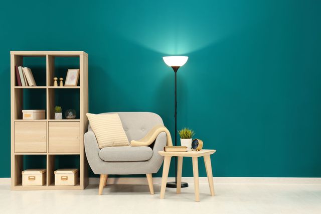 Green background living room with isolated lamp 